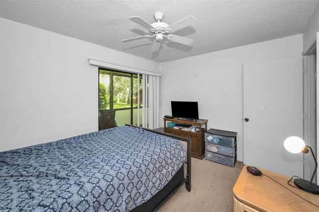 Bedroom with sliders to patio | Image 22