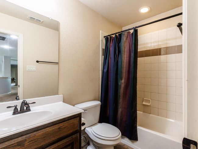 This full bathroom includes tile flooring and a bathtub/shower combo. | Image 26