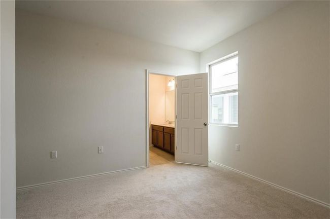 Empty room featuring light carpet and baseboards | Image 23