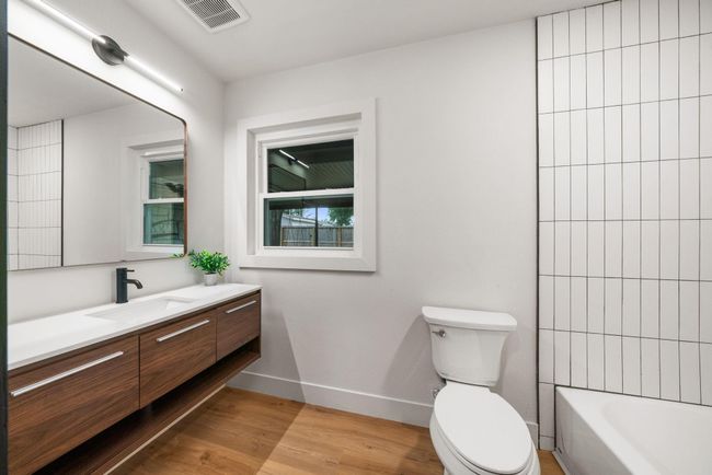 Hallway full bathroom with tub/shower and 48” vanity | Image 15