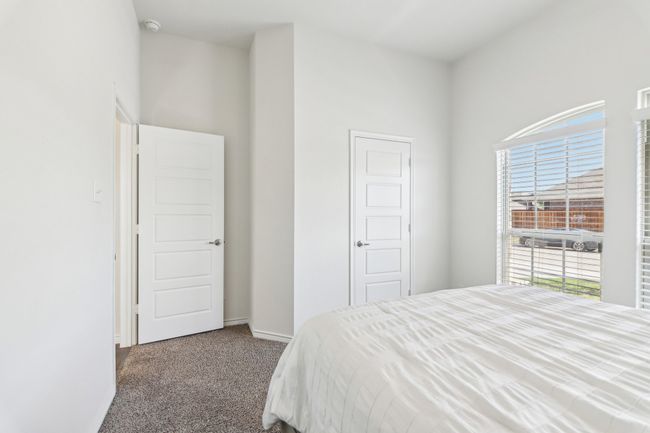 Carpeted bedroom with baseboards | Image 28