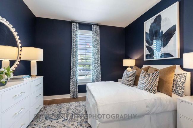 Bedroom with light wood finished floors and baseboards | Image 25