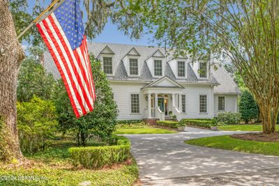 Gorgeous architecturally classic home with circular Drive and lush landscaping | Image 1