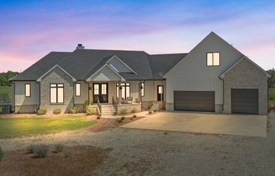 Modern inspired farmhouse with a garage and covered porch | Image 2