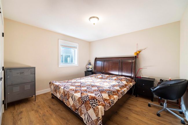 Bedroom with wood finished floors and baseboards | Image 14
