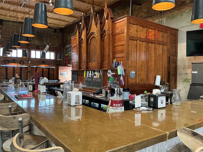 Bar featuring a high ceiling | Image 14