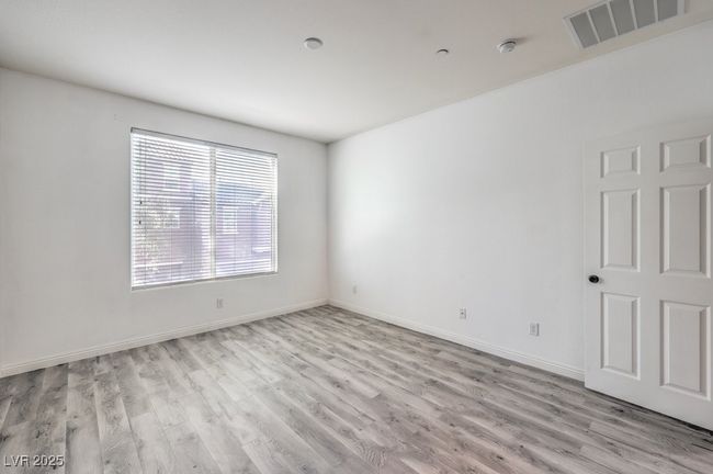 Unfurnished room featuring light wood-style flooring, baseboards, and visible vents | Image 18