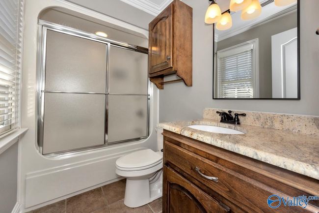 Tile flooring, tub/shower combo, recessed lighting, crown molding | Image 29