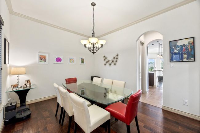 The dining is connected to the kitchen and sits just off of the foyer. | Image 8