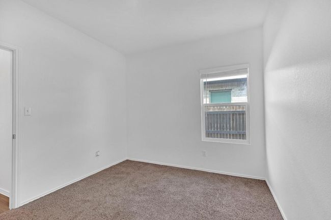 Carpeted spare room with baseboards | Image 18