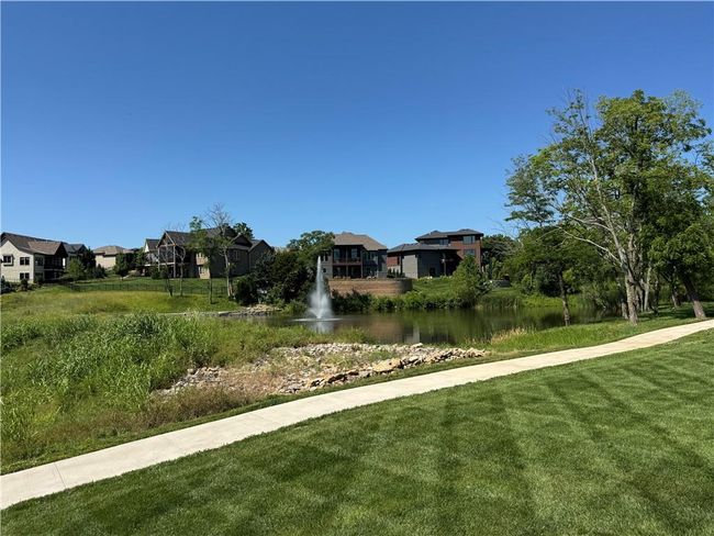 View of grassy yard with a water view and a residential view | Image 15