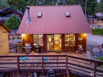 Exterior twilight view 2 of home w/ outdoor living area overlooking Lake Chelan. | Image 2