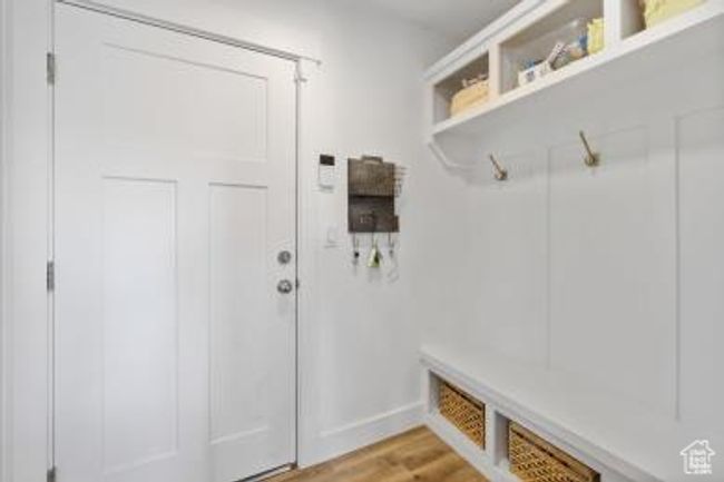 Mudroom featuring baseboards and light wood-style floors | Image 13