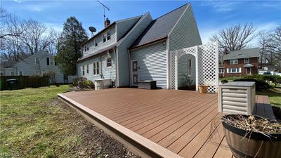 Wooden terrace featuring a lawn | Image 2