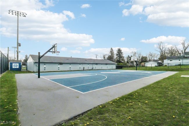 View of sport court with fence, a lawn, and community basketball court | Image 37