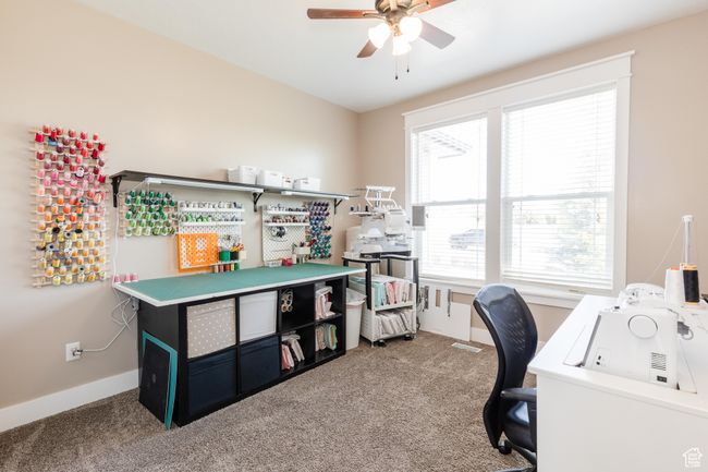Home office featuring carpet flooring and a ceiling fan | Image 18