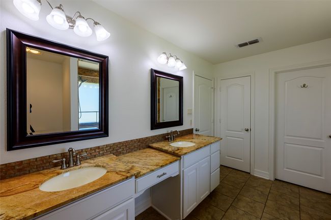 Bathroom featuring tile patterned flooring, a sink, visible vents, and double vanity | Image 14