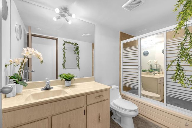 Full bath with visible vents, toilet, vanity, and a shower stall | Image 17