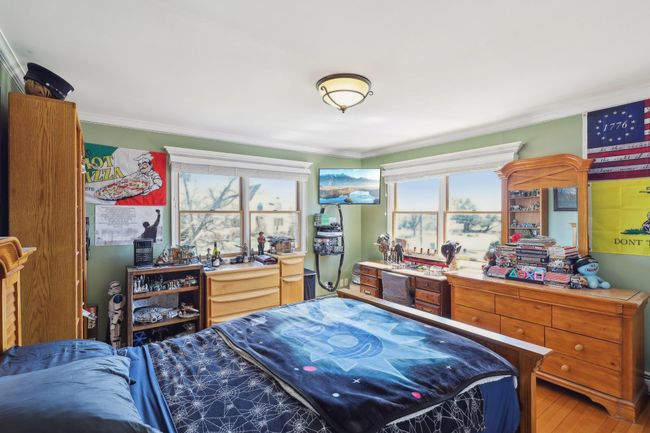 Bedroom featuring ornamental molding and light wood-style floors | Image 18