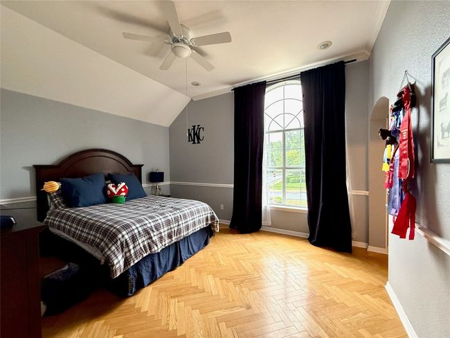 Bedroom featuring vaulted ceiling, baseboards, and a ceiling fan | Image 29