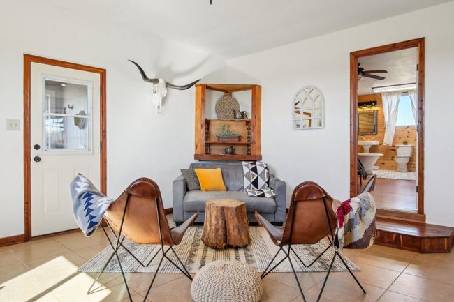 View of the farmhouse with the kitchen island at your back. | Image 5