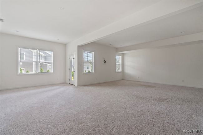 Unfurnished room featuring light carpet | Image 38