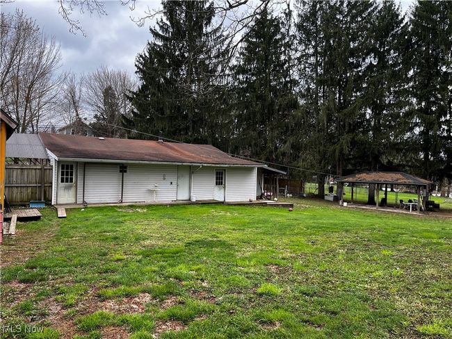 View of yard with a gazebo and fence | Image 14