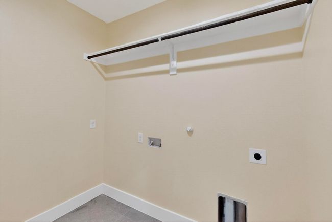Washroom with electric dryer hookup, washer hookup, and hookup for a gas dryer | Image 28