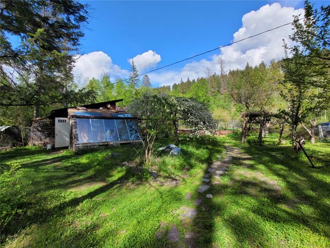 View of grassy yard featuring an outdoor structure | Image 106