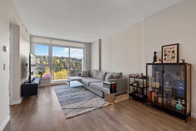 Living room featuring baseboards and wood finished floors | Image 6