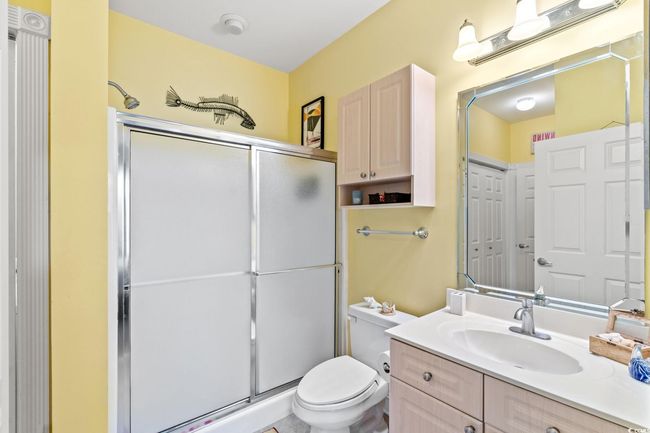 Full bathroom featuring vanity and a shower stall | Image 12