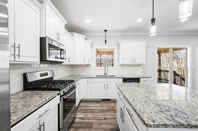 Bright Kitchen with stainless appliances. | Image 35