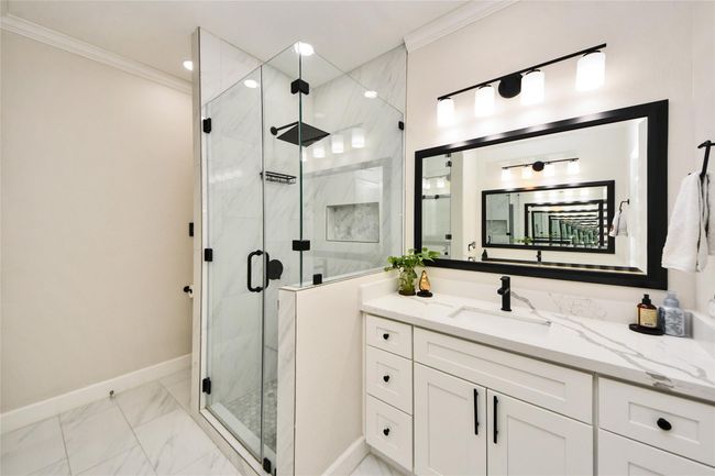 New lighting, walk-in shower, and beautiful flooring. | Image 18
