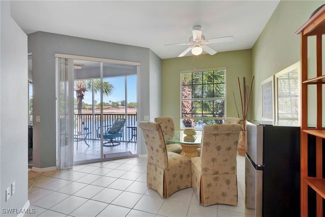 Dining room featuring a ceiling fan, light tile patterned floors, and baseboards | Image 16
