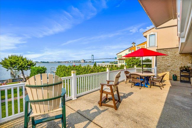 View of patio with a water view and outdoor dining space | Image 32