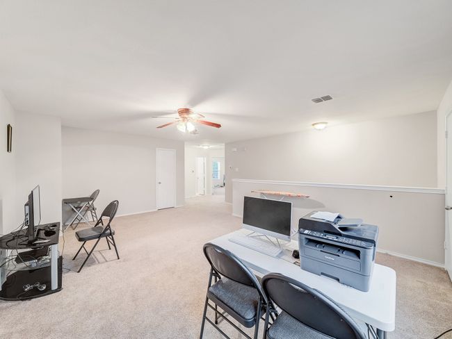 Office featuring carpet floors, ceiling fan, and baseboards | Image 20