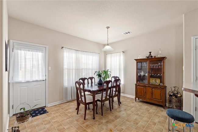 dining room with door to back yard. | Image 13