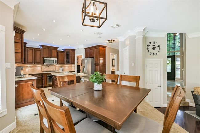 Abundant cabinetry offers exceptional storage solutions. | Image 10