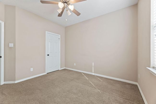 3rd bedroom with ceiling fan | Image 31