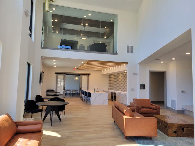 Building lobby featuring a towering ceiling and recessed lighting | Image 29