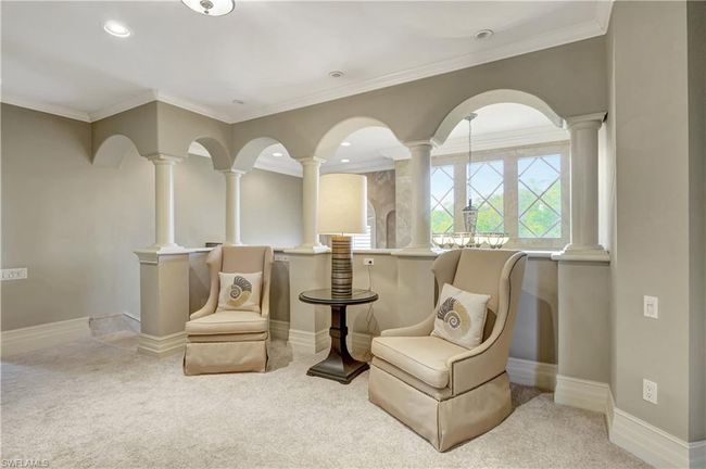 Sitting room featuring ornamental molding, recessed lighting, carpet flooring, and decorative columns | Image 10