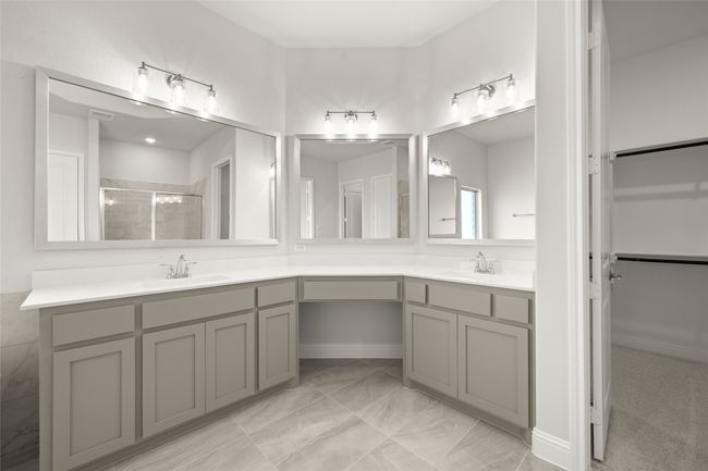 Bathroom with a stall shower, double vanity, and marble finish floors | Image 18