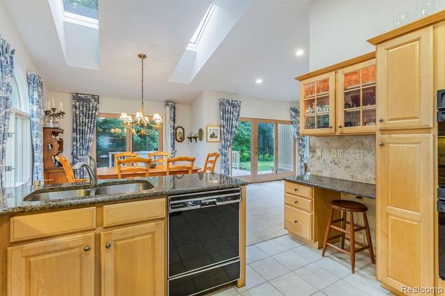 View from Kitchen into Dining Area with Doors to Back Deck | Image 5