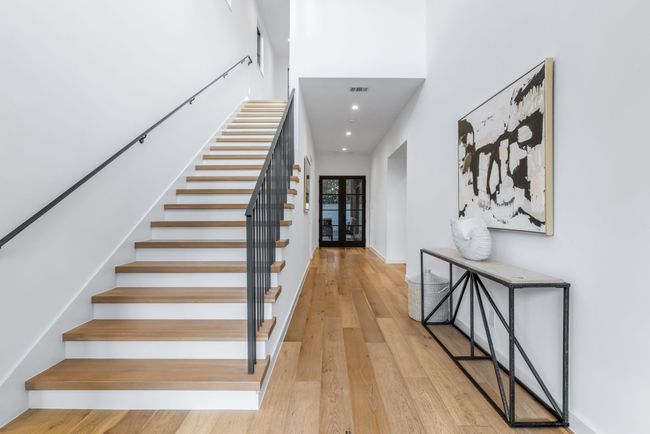 Staircase with hardwood / wood-style flooring, recessed lighting, and french doors | Image 4