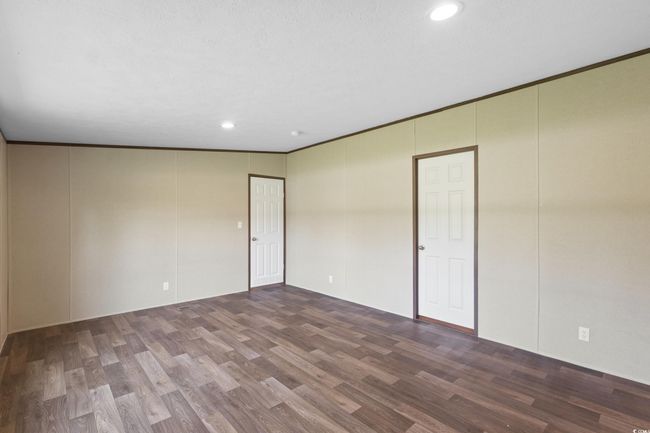 Unfurnished room featuring wood finished floors and recessed lighting | Image 18