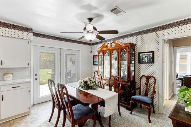Great-sized dining area (13x9) with direct access to the back patio, offering plenty of space to accommodate a dining table of your choice for gatherings & everyday meals. | Image 10