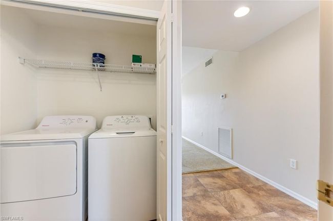 Laundry room featuring baseboards, visible vents, laundry area, and washer and clothes dryer | Image 27