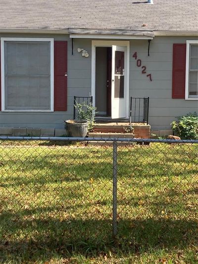 View of exterior entry with a yard | Image 1