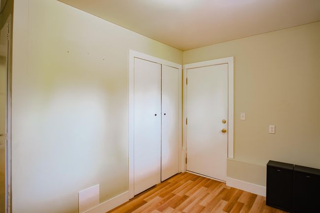 Unfurnished bedroom featuring baseboards, light wood-style floors, and a closet | Image 28