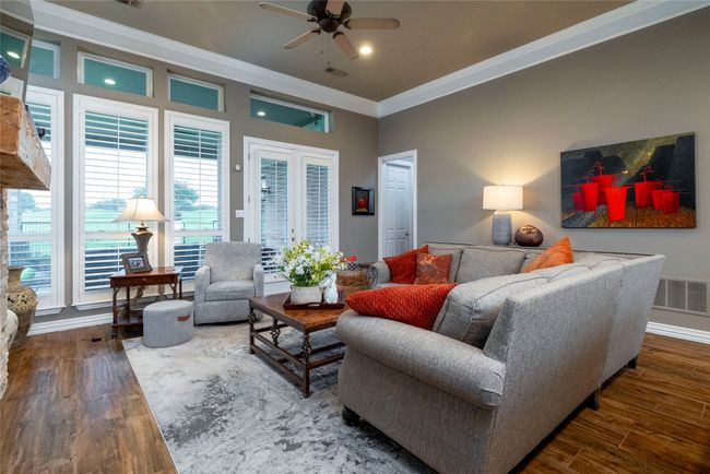 Living room with recessed lighting, crown molding, and ceiling fan | Image 13